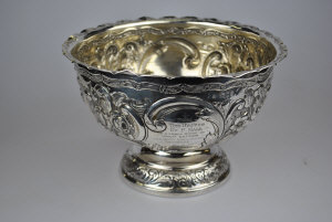 Appraisal: An Edwardian silver stemmed rose bowl profusely embossed Wakely Wheeler