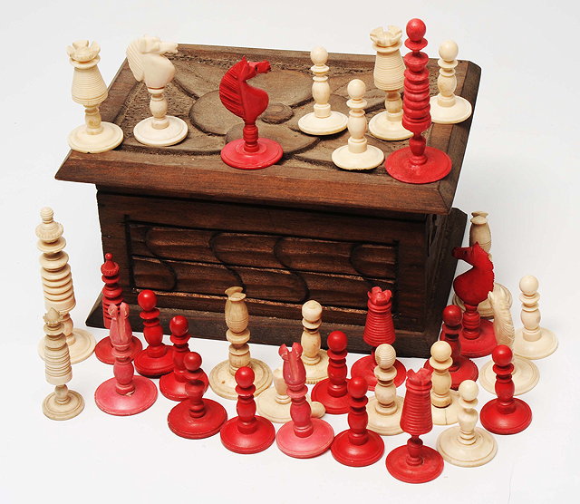 Appraisal: A TURNED AND STAINED BONE CHESS SET cm high with