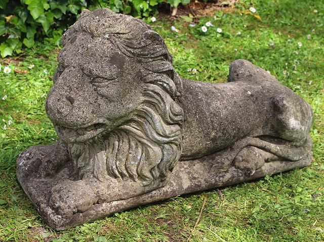 Appraisal: AN OLD CAST CONCRETE RECUMBENT LION cm long