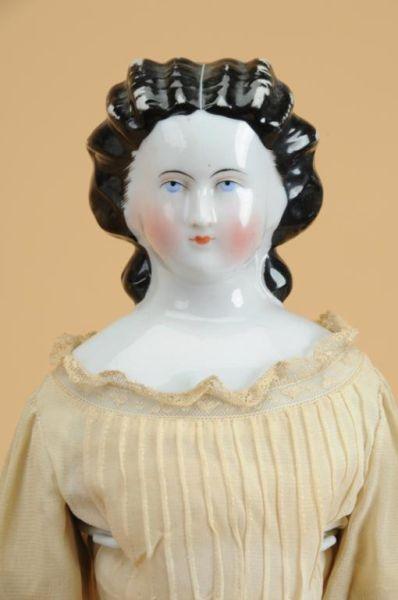 Appraisal: China Lady Doll with Snood Germany ca glazed porcelain shoulder