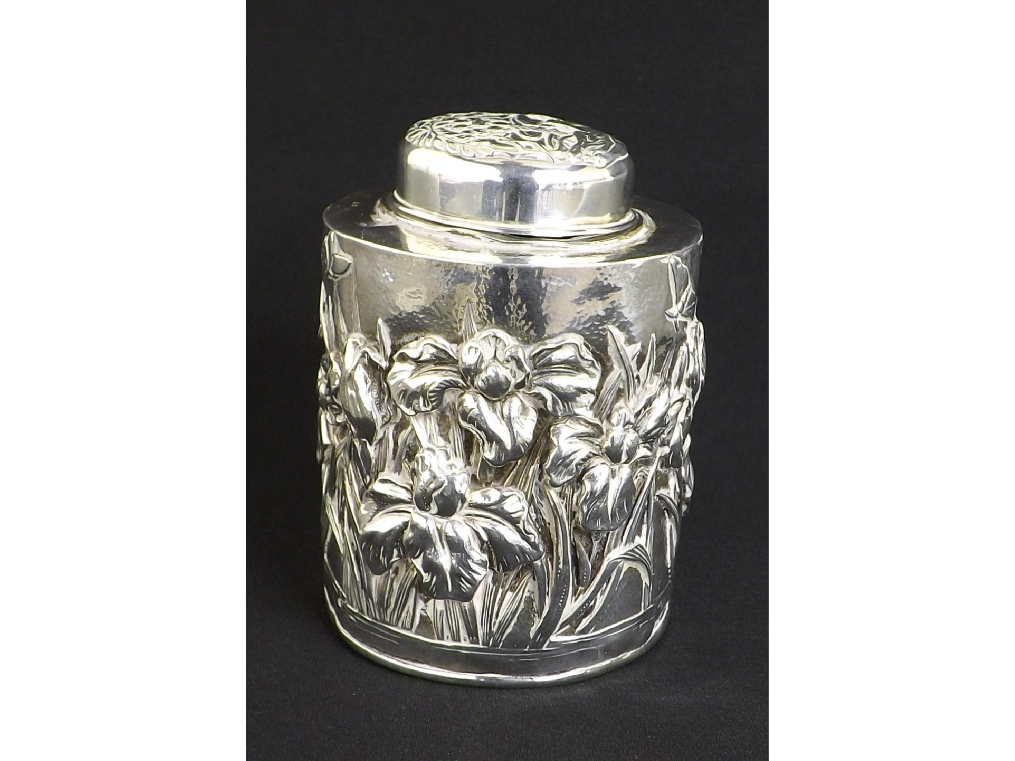 Appraisal: Chinese white metal cylindrical tea caddy embossed with flowers butterflies