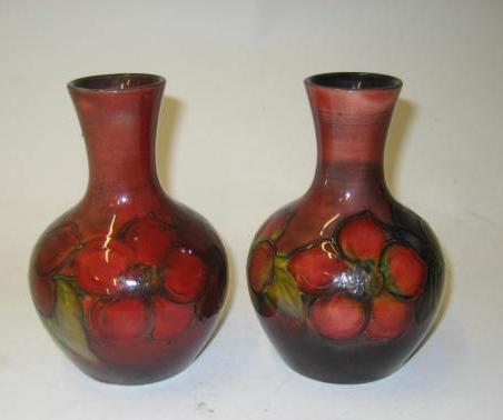 Appraisal: A PAIR OF MOORCROFT POTTERY FLAMBE VASES of baluster form