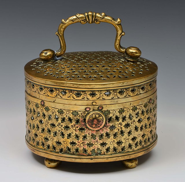 Appraisal: The McKelney CollectionA PERSIAN BRASS INCENSE BURNER with pierced decoration