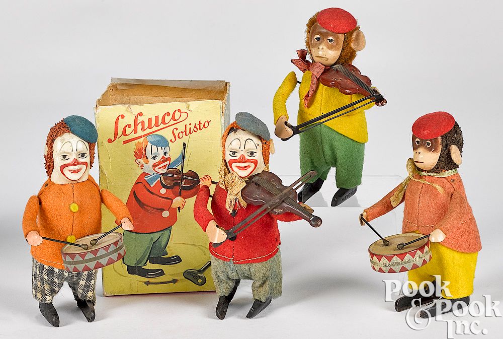 Appraisal: Four Schuco wind-up toys Four Schuco wind-up toys to include