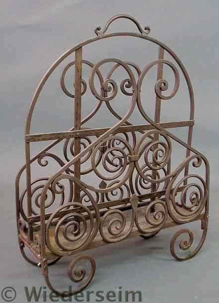 Appraisal: Decorative wrought iron magazine rack th c h x w