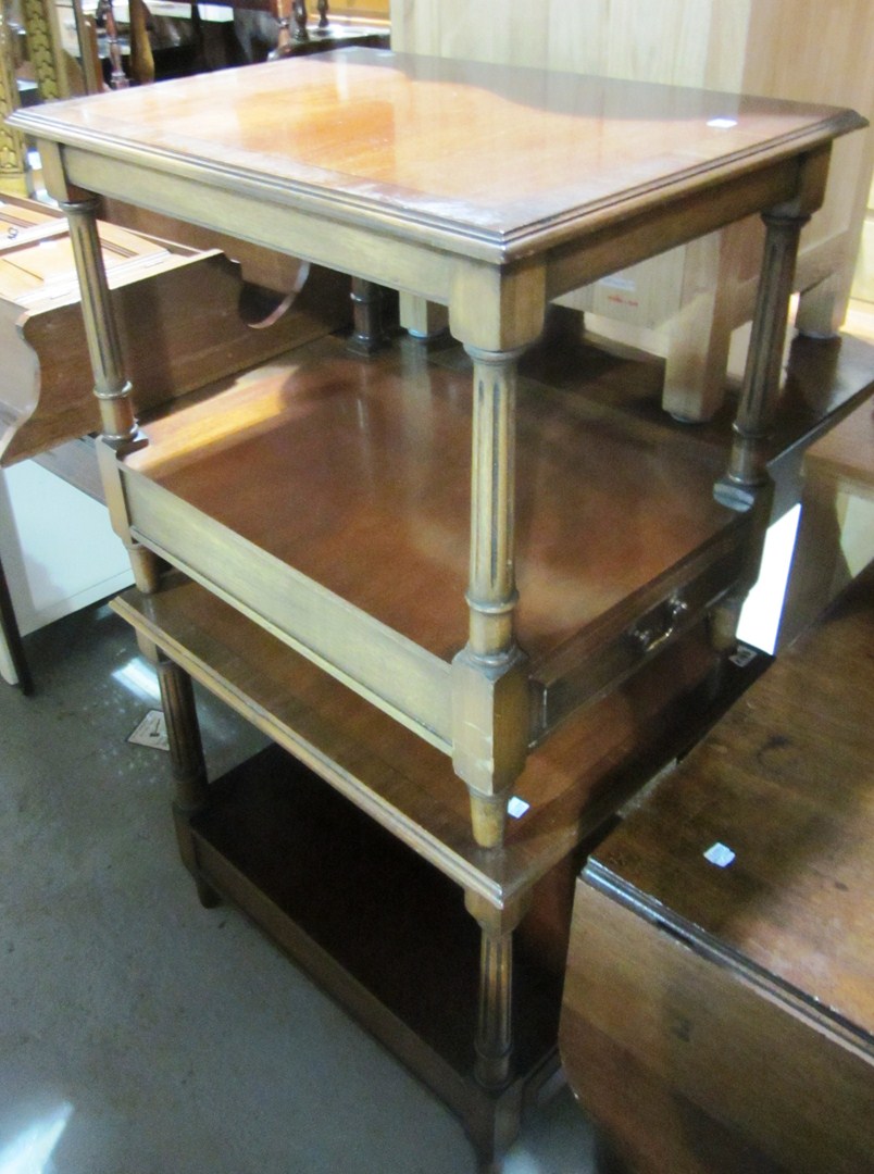 Appraisal: A pair of th century walnut two tier side tables