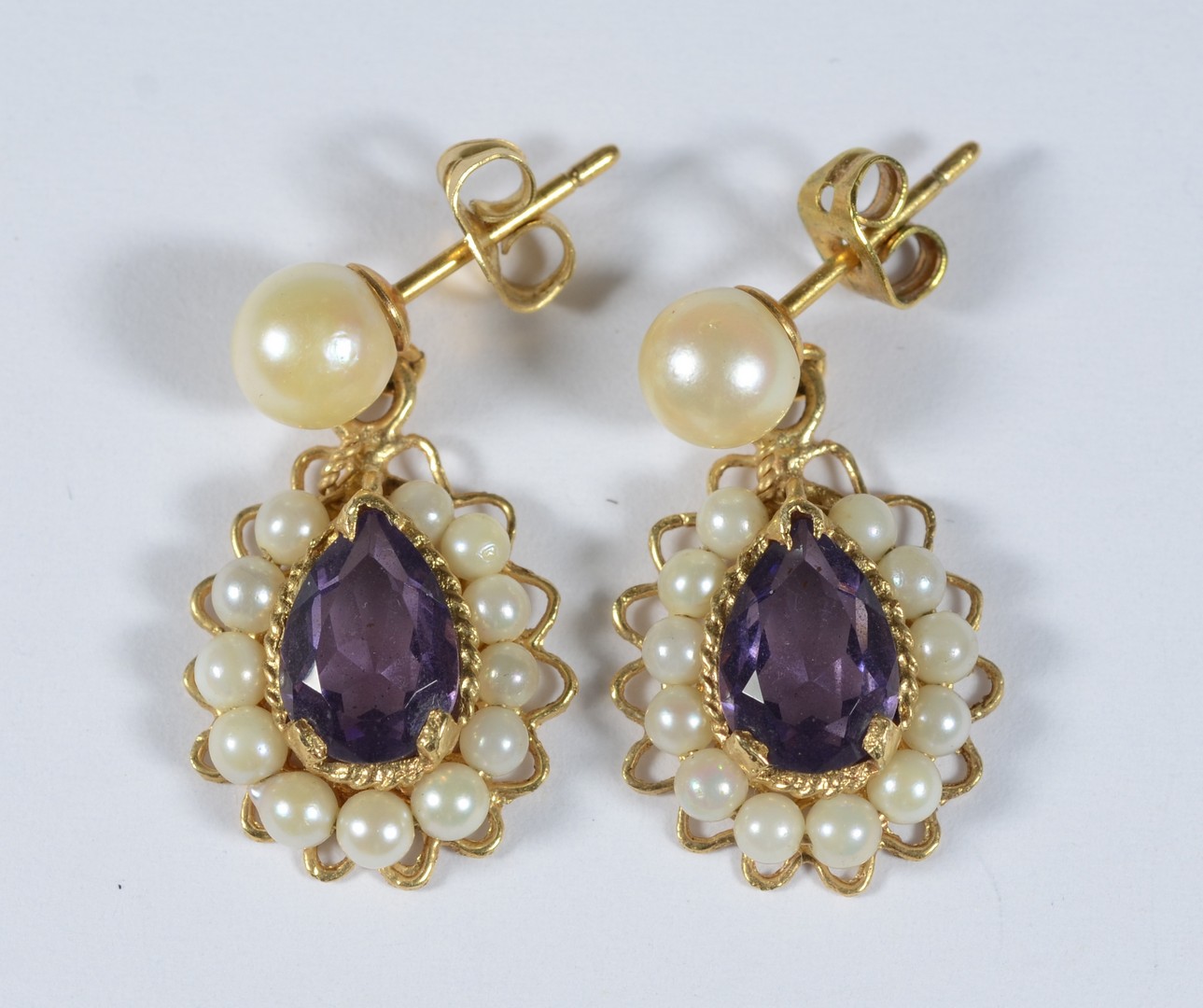 Appraisal: Pr K YG pearl amethyst colored teardrop earrings h dwt