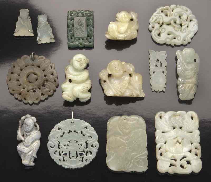 Appraisal: Chinese Ming-Qing carved jade pendantsdepicting boys dragons and flowers Largest