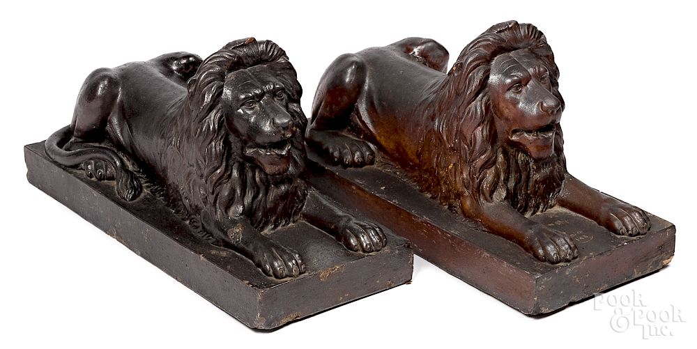 Appraisal: Pair of large English sewer tile recumbent lions Pair of