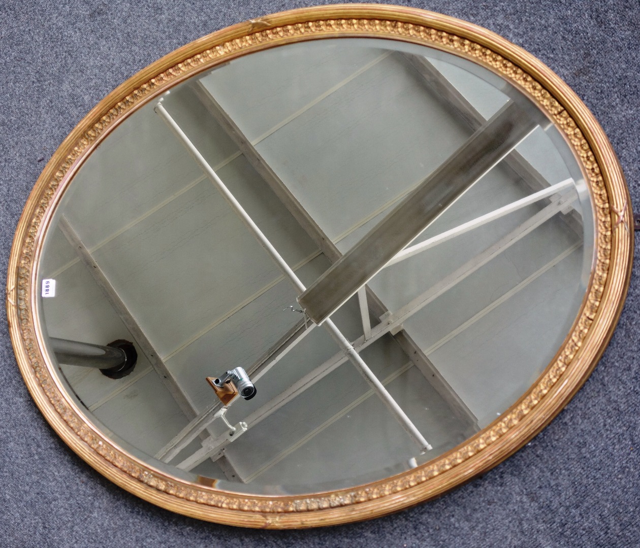 Appraisal: An early th century gilt framed oval wall mirror with