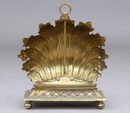 Appraisal: DECORATIVE BRASS SHELL-FORM GAS HEATER The scalloped back rising from