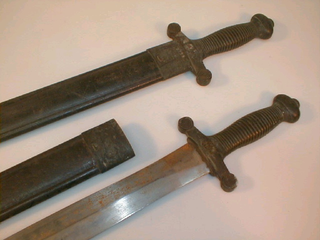 Appraisal: Two thC French Gladius pattern side arms ribbed grips by