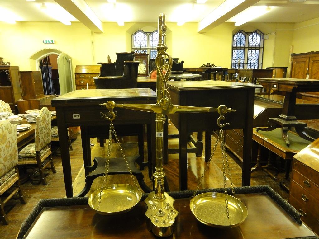 Appraisal: A large polished brass weighing scale with central turned column