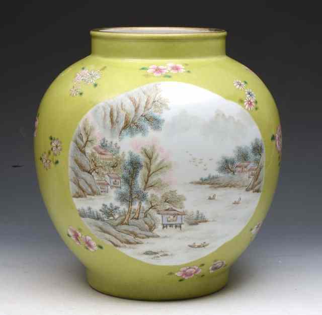 Appraisal: A CHINESE GREEN GROUND OVOID VASE with panels of landscape