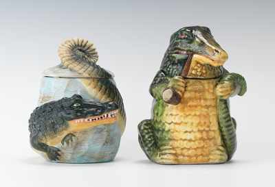 Appraisal: One Bisque and One Majolica Alligator Humidors The larger jar