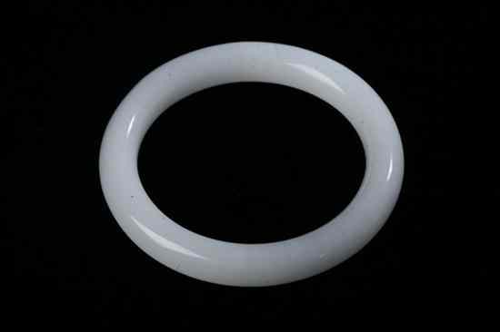 Appraisal: CHINESE CARVED WHITE JADE BANGLE - in diam