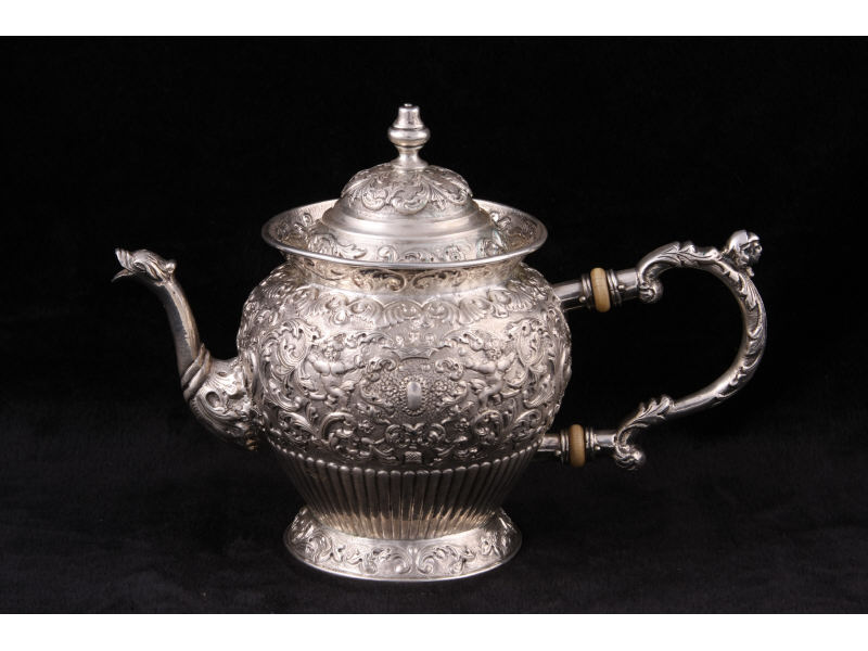 Appraisal: Dutch Repousse Silver Teapot bulbous form with ornate repousse design