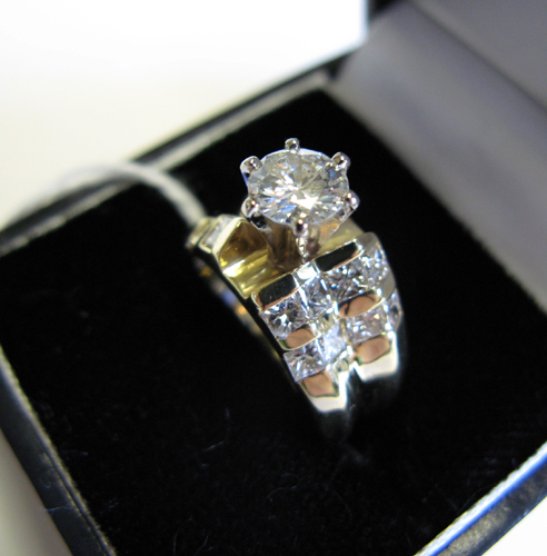 Appraisal: DIAMOND AND EIGHTEEN KARAT GOLD RING centered and prong set