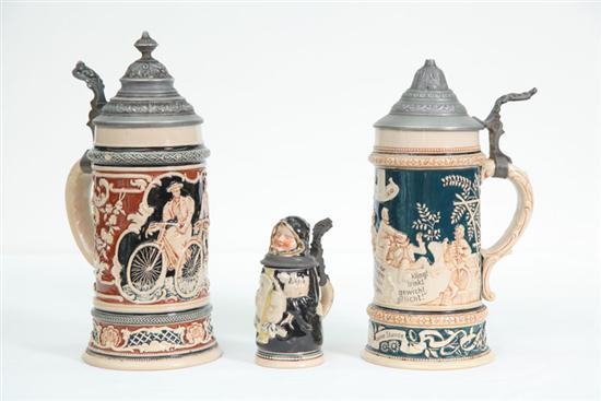 Appraisal: THREE STEINS All with pewter lids Two with embossed decoration