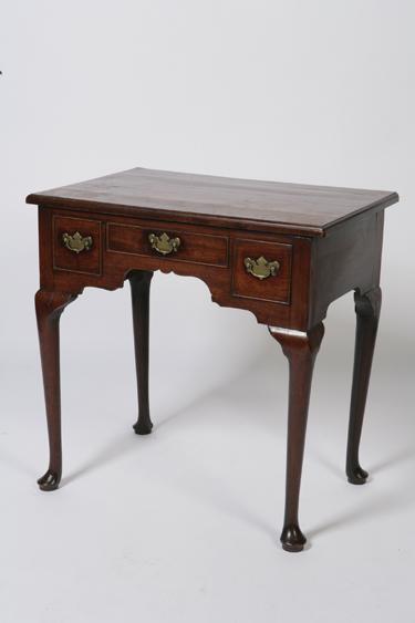 Appraisal: A GEORGE II MAHOGANY SIDE TABLE the rectangular top with