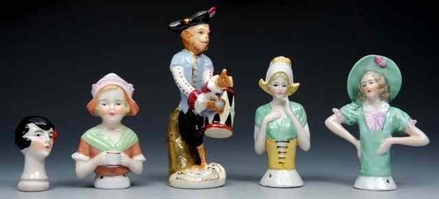 Appraisal: A CONTINENTAL PORCELAIN MONKEY BAND FIGURE and four porcelain pin