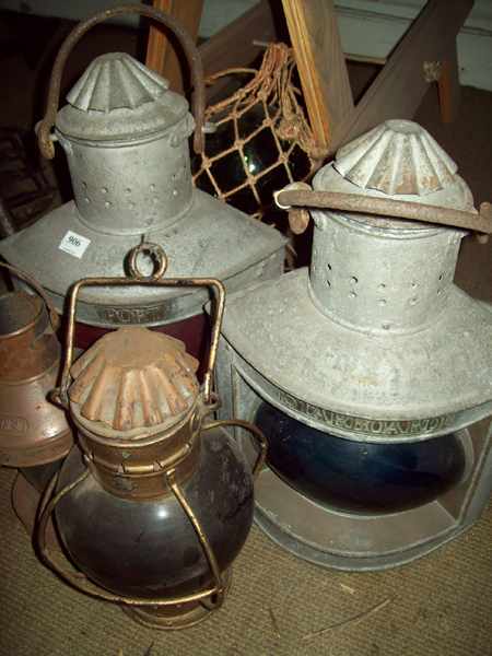 Appraisal: FOUR SHIP LANTERNS AND THREE GLASS BUOYS