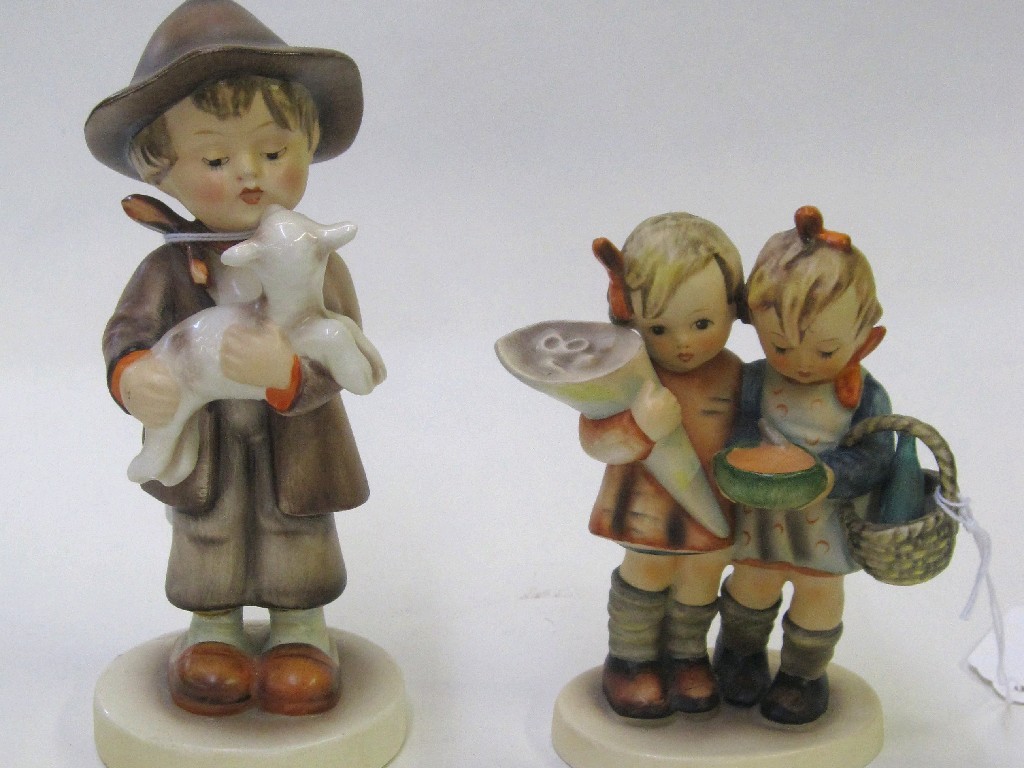 Appraisal: Pair of Staffordshire wally dugs and two Hummel figures 'Going