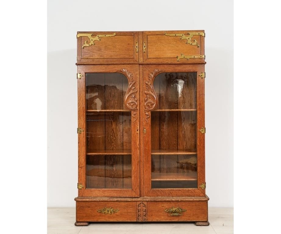 Appraisal: Two-door oak and glass cabinet circa with brass hinges and