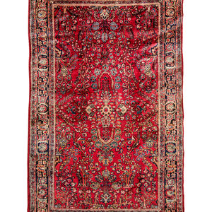 Appraisal: A Sarouk Wool Rug Circa feet inches x feet inches