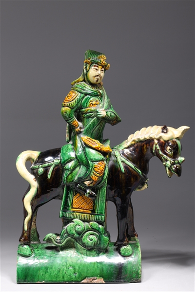 Appraisal: Chinese Late Ming dynasty sancai glazed horse and rider roof