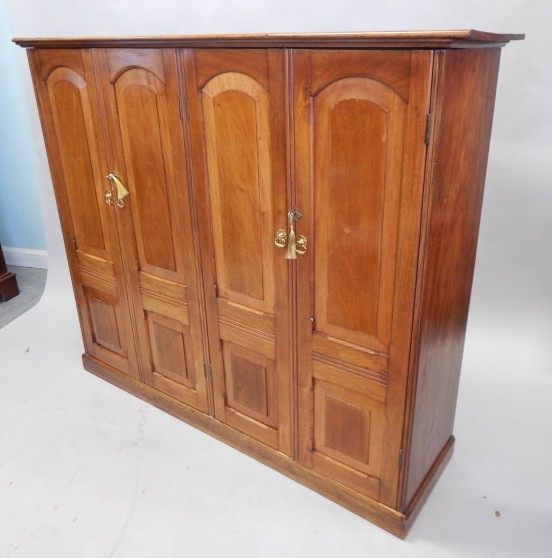 Appraisal: An unusual Victorian mahogany cupboard the top with a moulded