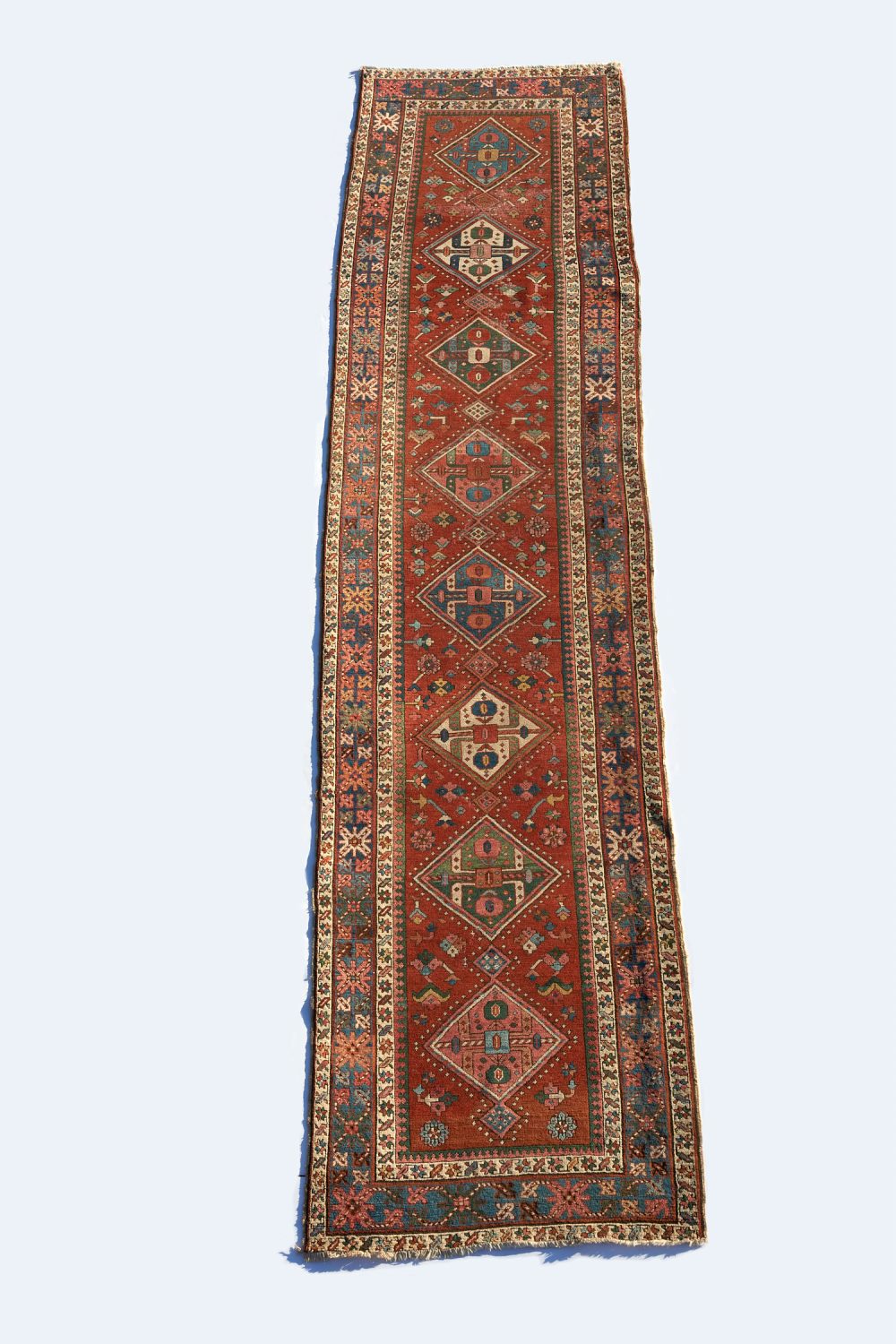 Appraisal: ANTIQUE HERIZ RUNNER c Northwest Persia low pile wool crimson