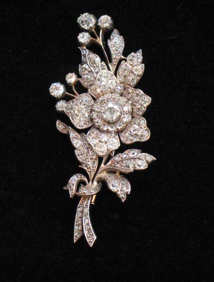 Appraisal: A DIAMOND-SET BROOCH in the form of a bouquet of