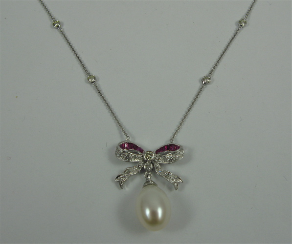 Appraisal: PEARL RUBY AND K WHITE GOLD NECKLACE with an oval