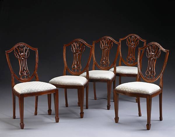 Appraisal: A set of eight George III style walnut dining chairs