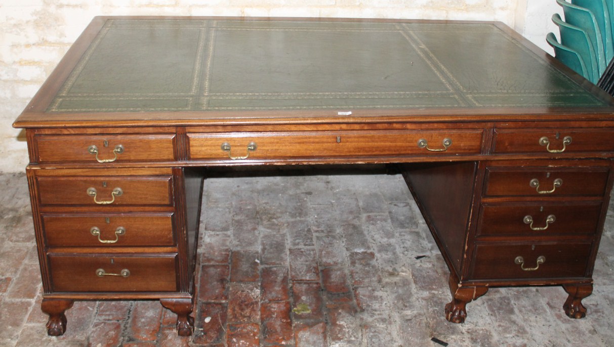 Appraisal: A thC mahogany partner's desk with a one piece green