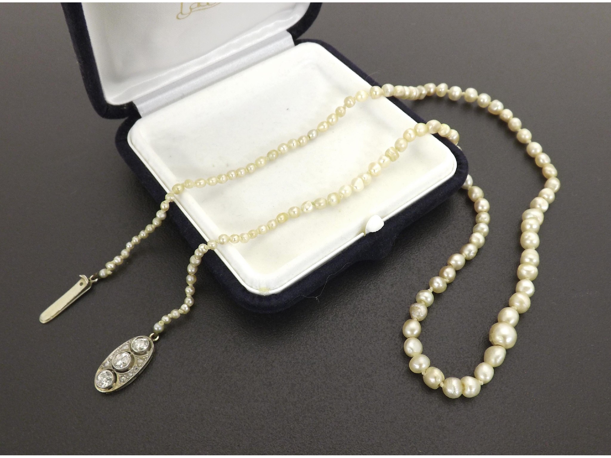 Appraisal: Pretty graduated cultured pearl necklet the oval clasp with three