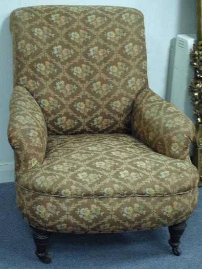 Appraisal: A late th Century upholstered armchair with padded seat back