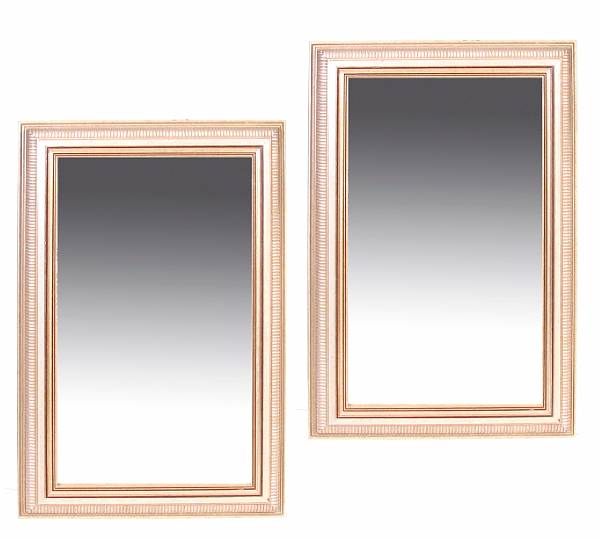 Appraisal: A pair of Neoclassical style silvered wood mirrors height in