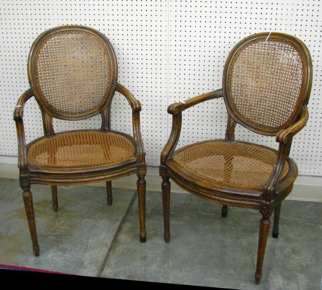 Appraisal: Pair of French Louis XVI style arm chairs with cane