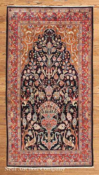 Appraisal: A Persian Kashan Carpet navy and crimson ground central tree