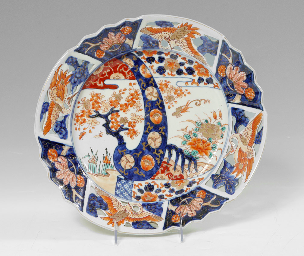 Appraisal: RETICULATED JAPANESE IMARI DEEP PLATE Reticulated rim with bird and