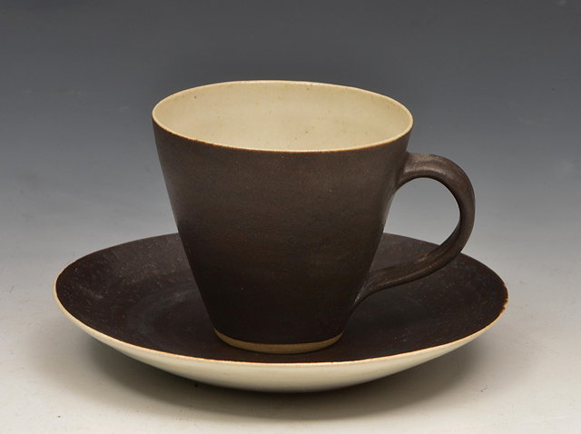 Appraisal: Lucie Rie Austrian British - Cup and saucermatt black glazeimpressed