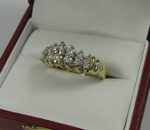 Appraisal: DIAMOND AND K GOLD RING set with round-cut diamonds together