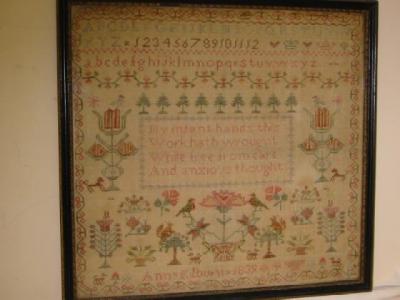 Appraisal: A WOOLWORK SAMPLER by Ann Kilburn with central stanza alphabet