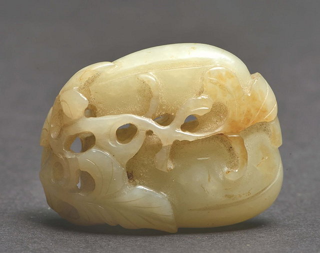 Appraisal: A CHINESE WHITE MUTTON FAT JADE PENDANT carved as two