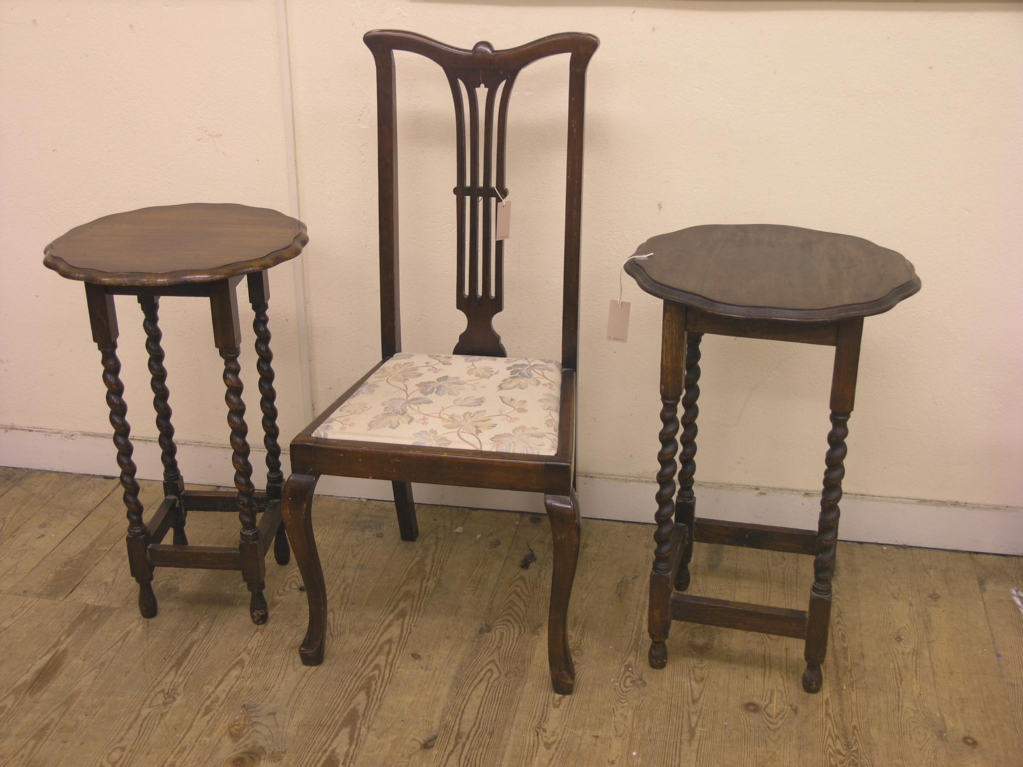 Appraisal: Two solid dark oak occasional tables on barley-twist underframes and