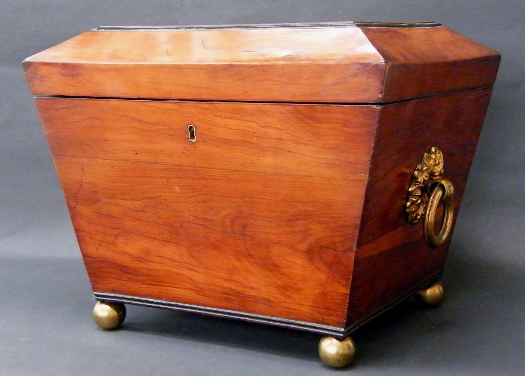 Appraisal: th century yew wood tea caddy of sarcophagus form with