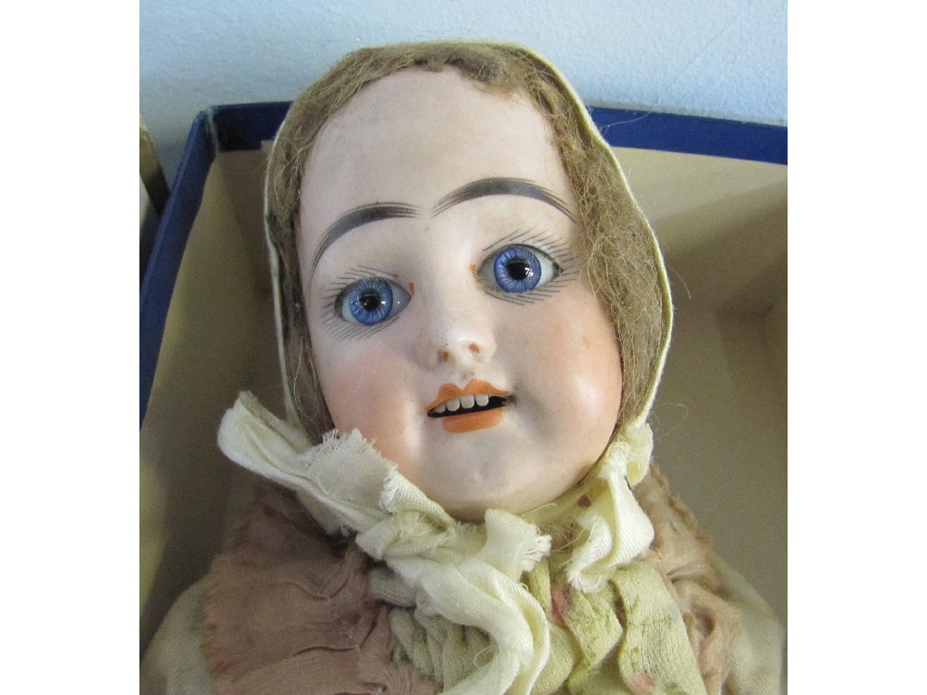 Appraisal: Bisque headed doll detached left leg