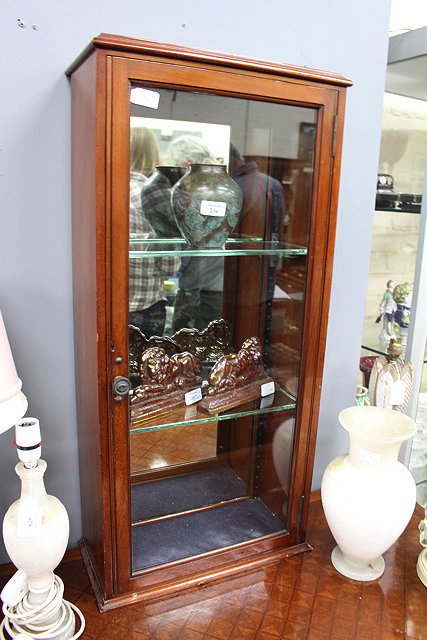 Appraisal: A VICTORIAN MAHOGANY MIRROR BACKED WALL CABINET with two adjustable